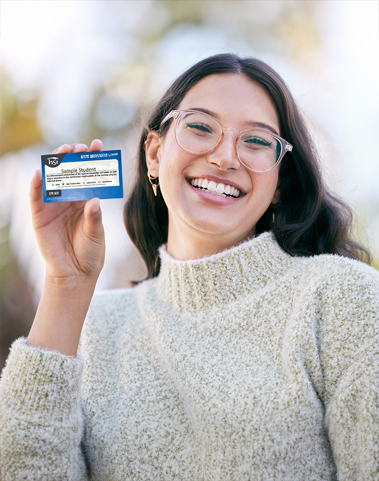 CPR Certification Card in hand