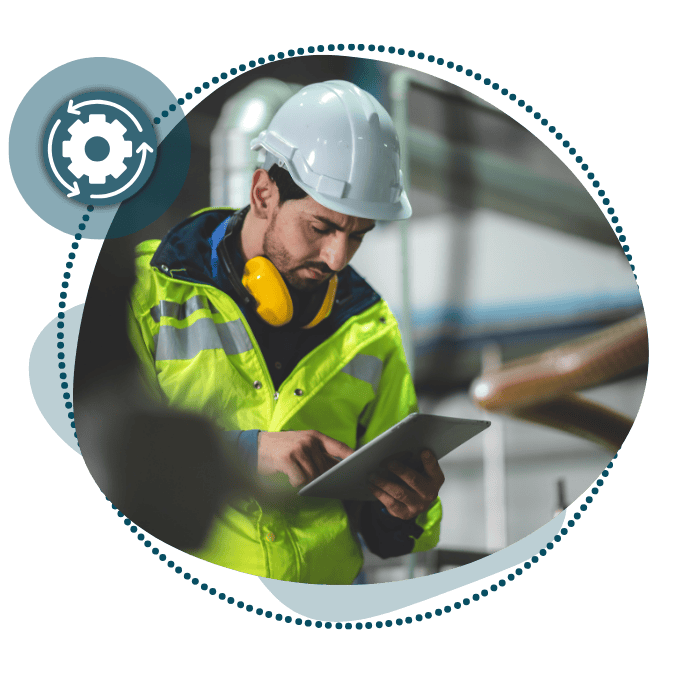 Male worker with protective equipment on using the HSI EHS System on an ipad