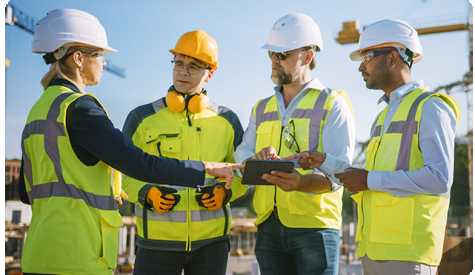 Construction Management holding ipad with EHS technology